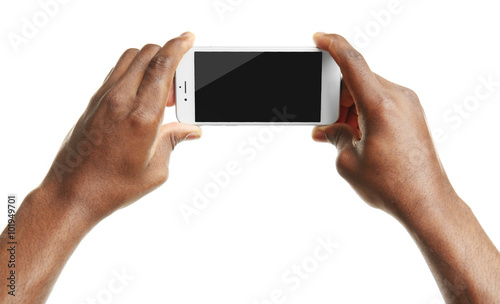 Hand holding mobile smart phone with blank screen, isolated on white