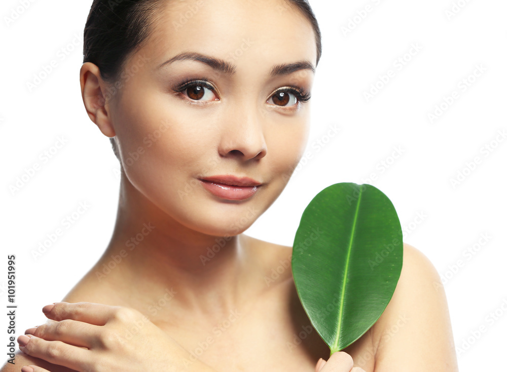 Portrait of beautiful woman with green leaf which isolated on white background Portrait of beautiful woman with green leaf which isolated on white background
