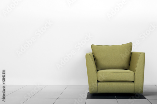 Living room interior with green armchair on white wall background