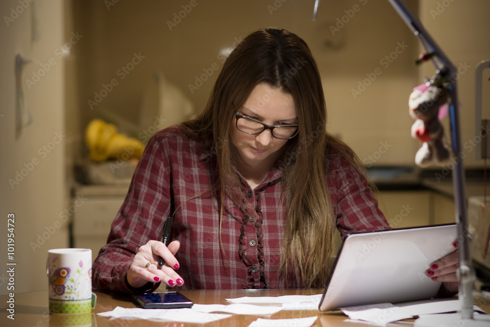 Housewife paying bills online Housewife paying bills online