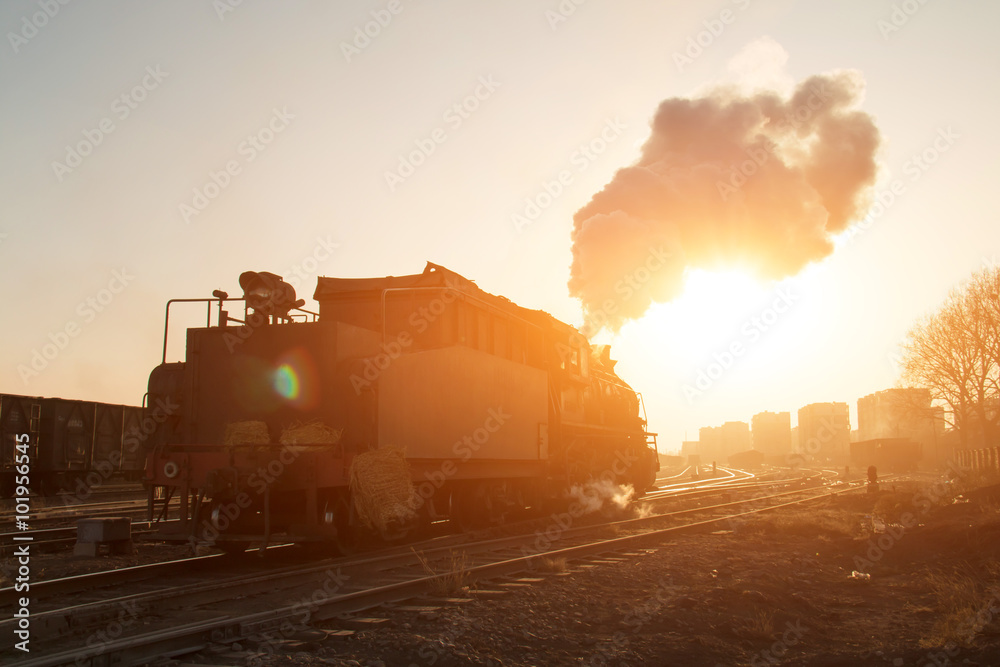 Steam locomotive at sunset