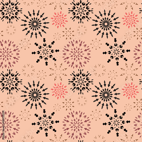 Christmas seamless pattern. Brown and orange snowflake signs on beige background. Winter theme retro texture. Chocolate snow. Vector illustration.