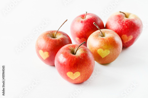 Red apples with a heart symbol