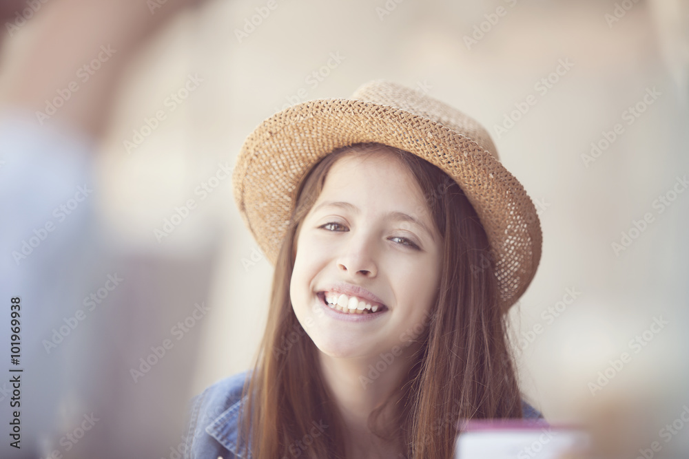 student with straw hat