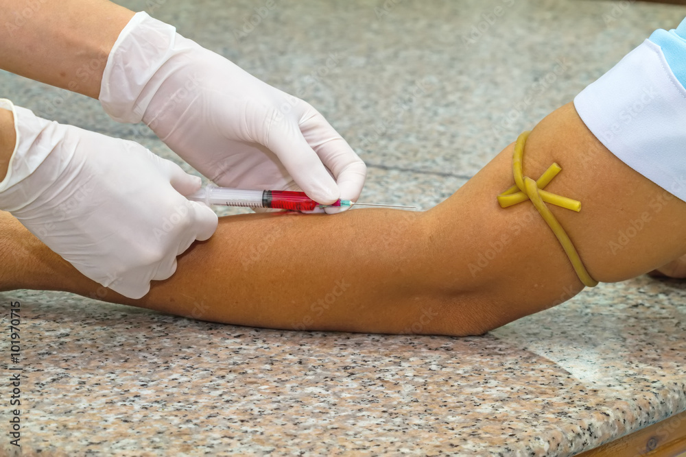 Blood test from venous vein of patient by female doctor Blood test from venous vein of patient by female doctor