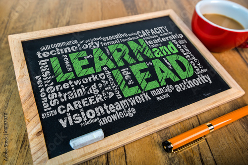 learn and lead word cloud on small blackboard