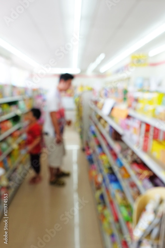 father and son as customer looking for shopping in convenience s