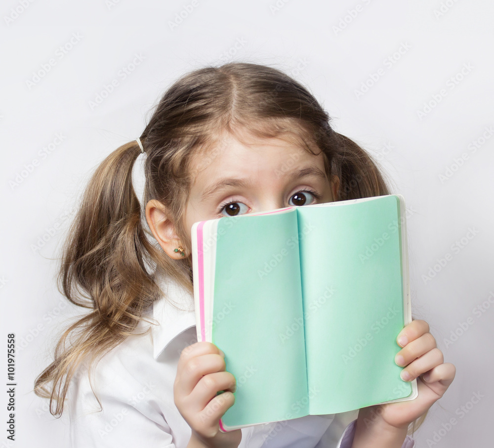 Child girl hold note book empty pages.Message communication conc Child girl hold note book empty pages.Message communication conc