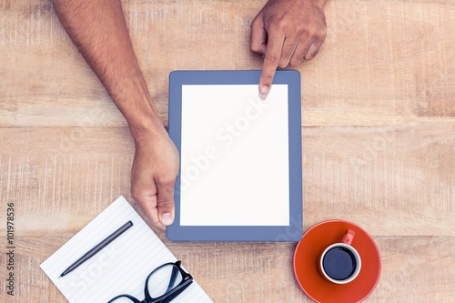 Overhead view of person holding on digital tablet
