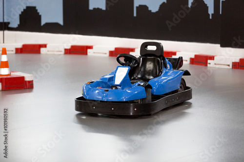 karting area with barriers and small blue kart