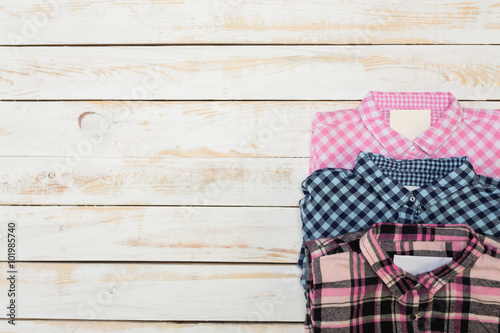 Woman's clothes on wooden background