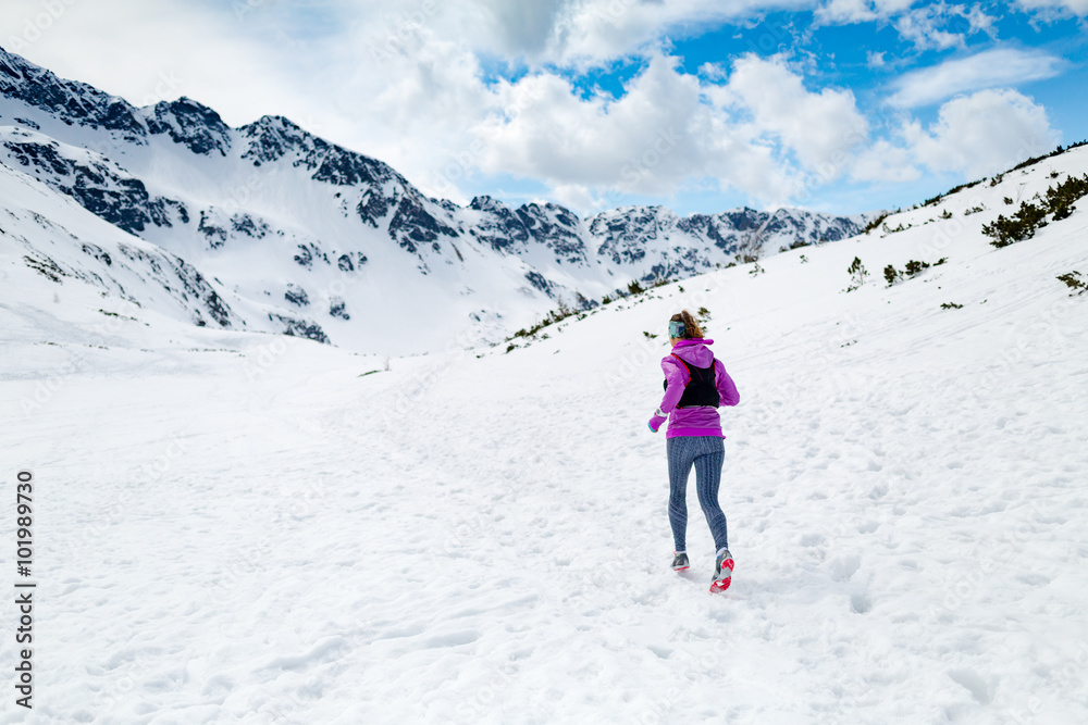 Winter running woman. Trail runner inspiration, sport and fitnes Winter running woman. Trail runner inspiration, sport and fitnes