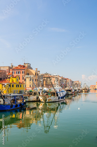 Fisherman boats moored along channel in Chioggia