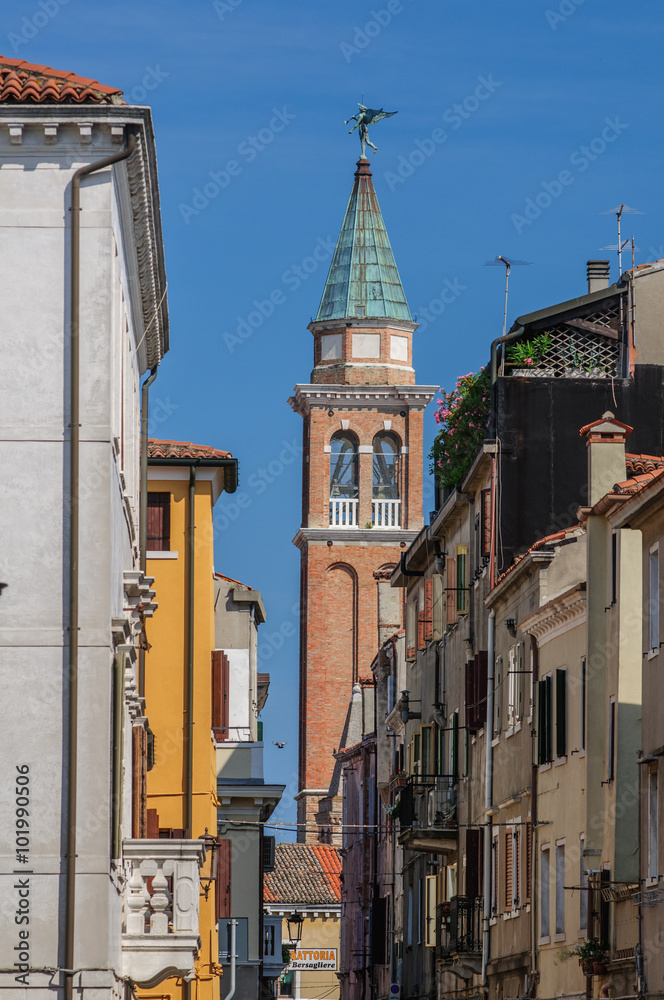 Fototapeta premium Street view with channels and houses in Chioggia