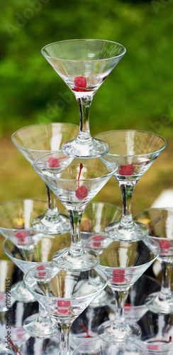 A pyramid of champagne glasses set for pouring a champagne. Selective focus