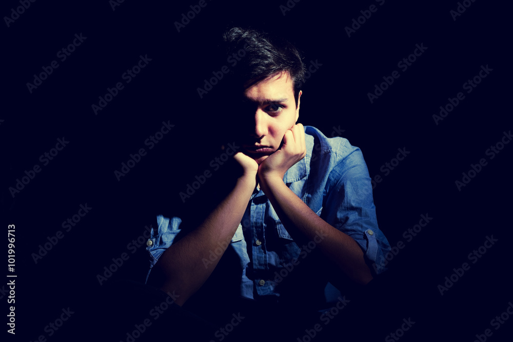 Portrait of a depressed man, intentionally toned image. Portrait of a depressed man, intentionally toned image.