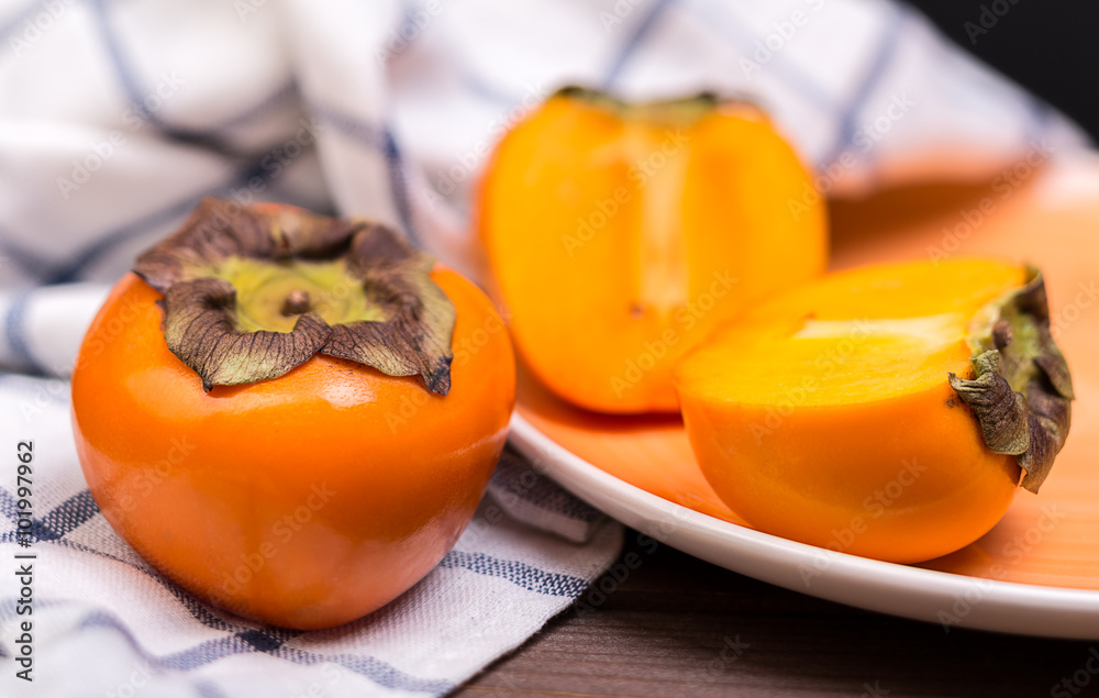 two ripe persimmons