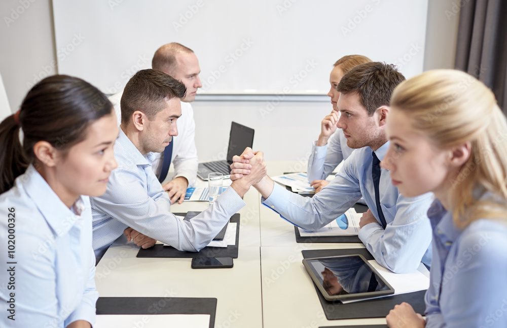 smiling business people having conflict in office smiling business people having conflict in office
