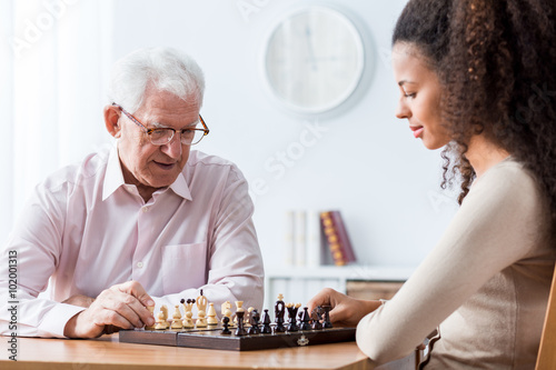 Retired man playing chess