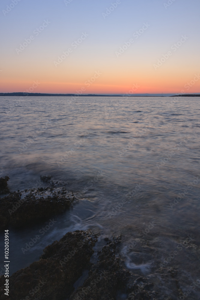 Obraz premium Rocky coast before sunrise in the summer morning in Croatia
