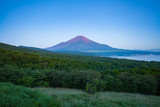 Red color at Top of Mountain Fuji in summer early morning seen from Lake Yamanaka , Yamanashi prefecture