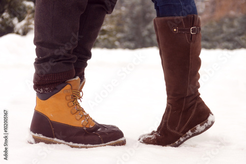Legs of couple in love in park in winter