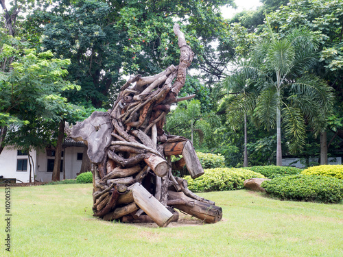 Old wood carving elephant in garden