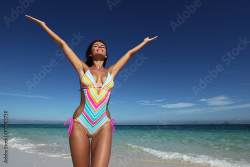 Happy woman on beach © yellowj