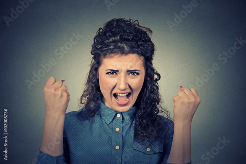 angry young woman having nervous breakdown screaming