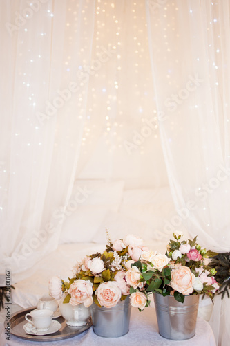 Bouquets of flowers in the bedroom, interior decor, romantic setting