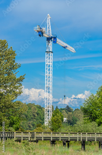 The site with cranes against blue sky