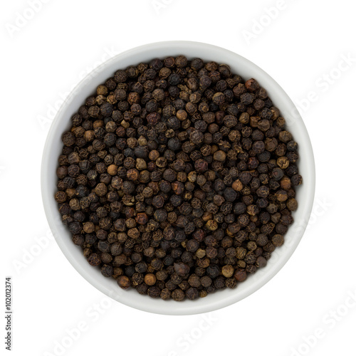 Whole Black Pepper in a Ceramic Bowl