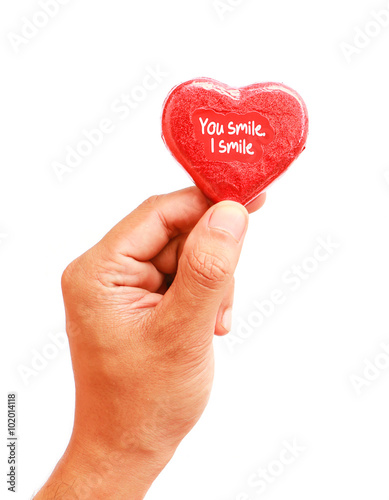 hands with chocolate heart isolated on white background, love concept.