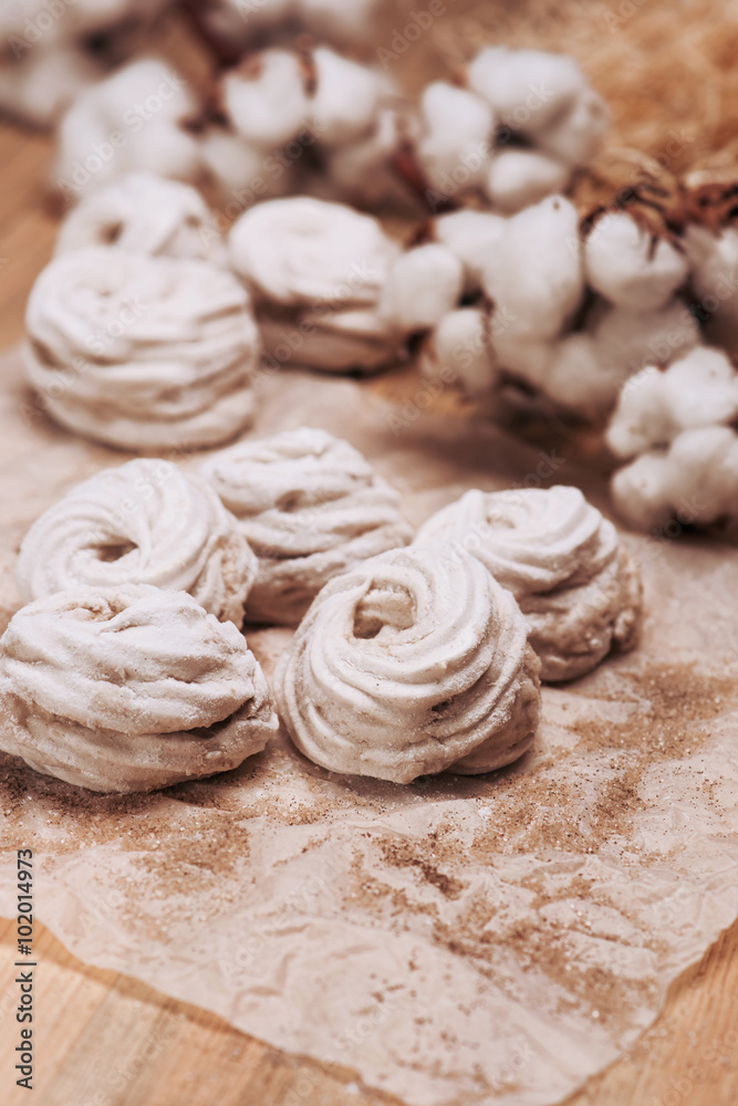 Homemade marshmallow Zephyr on a rustic wooden table