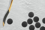 Hockey stick and puck on the ice