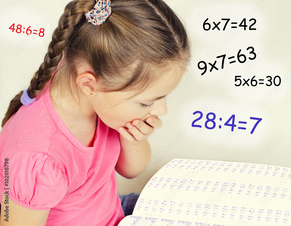 The girl tired to solve the examples in mathematics The girl tired to solve the examples in mathematics