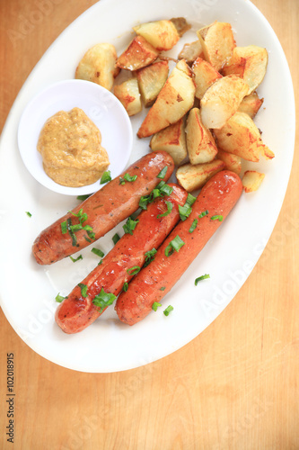 Sausage with potatoes and copy space