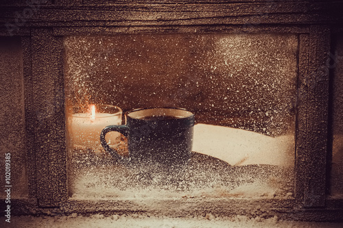 Hot Cup of coffee for the frozen winter window.