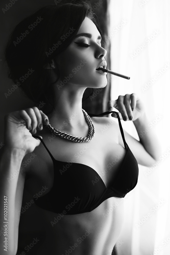 beautiful sexy girl with dark hair wears lingerie,smoking beside a window  Stock Photo | Adobe Stock