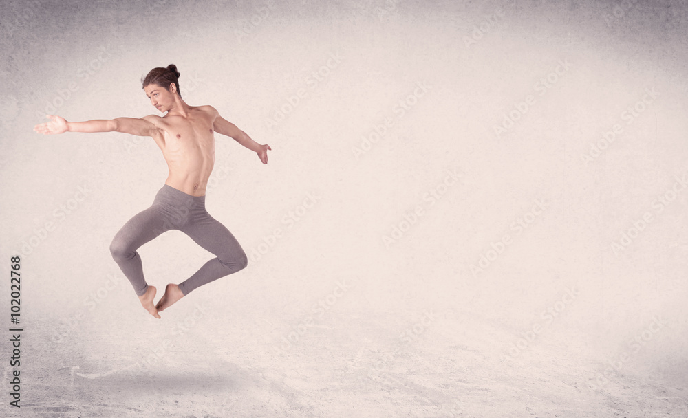 Modern ballet dancer performing art jump with empty background Modern ballet dancer performing art jump with empty background