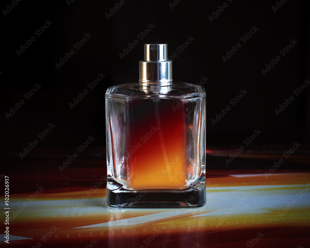 perfume bottle on a black background perfume bottle on a black background