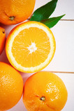 Orange fruit on white table
