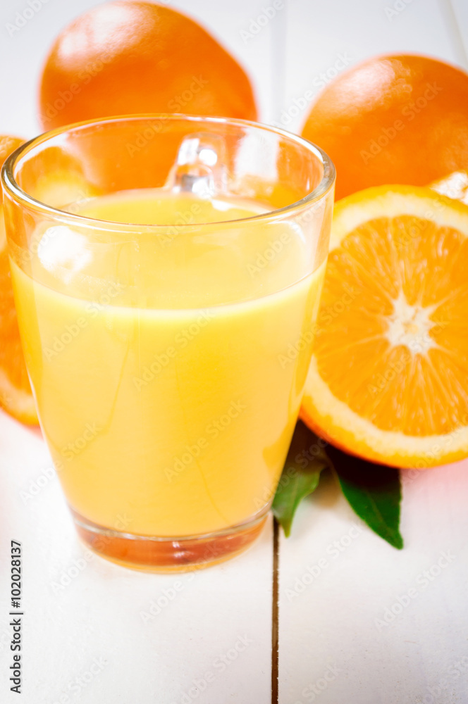 Orange Juice and orange fruit on white table