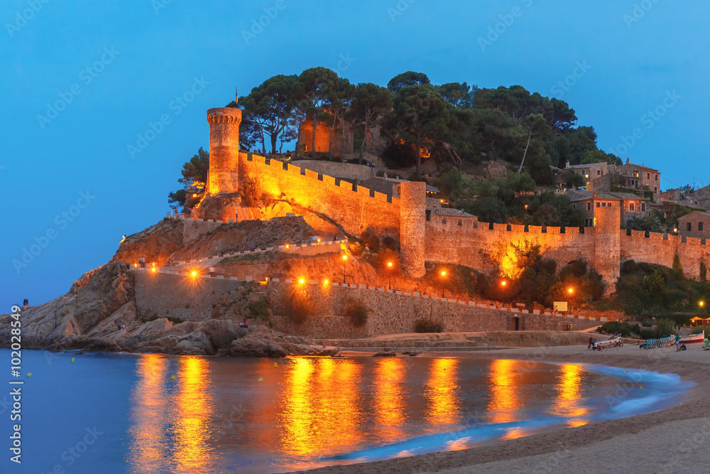 Night view of ancient fortress and Badia de Tossa bay in Tossa de Mar on Costa Brava, Catalunya, Spain