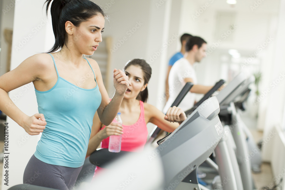 Young people training in the gym Young people training in the gym