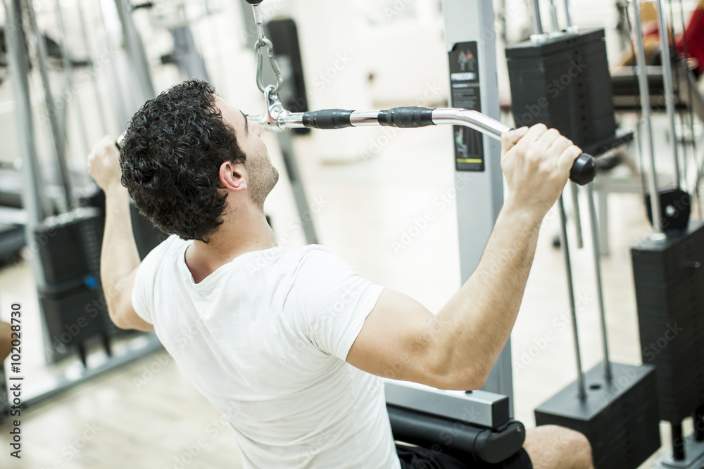 Young man training in the gym Young man training in the gym