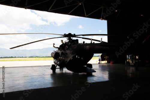 silhouette of a helicopter in the hangar