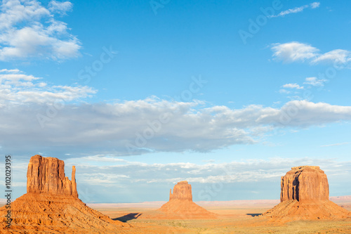 Three buttes in Monument Valley dramatic scenery.