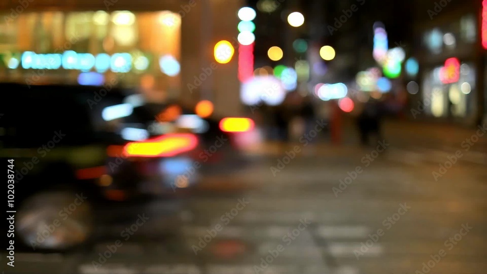 Out of focus shot of cars and taxi´s driving on a street in a big city Out of focus shot of cars and taxi´s driving on a street in a big city