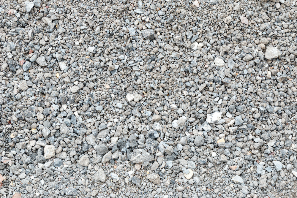 Textured background of pale crushed stone Textured background of pale crushed stone